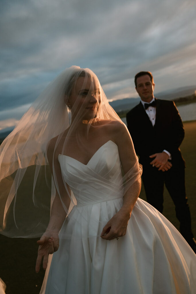 a bride and groom take sunset portraits during their TPC Colorado wedding