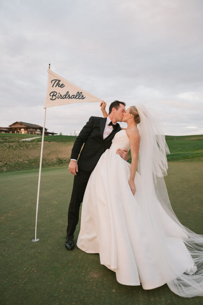 a bride and groom take sunset portraits during their TPC Colorado wedding